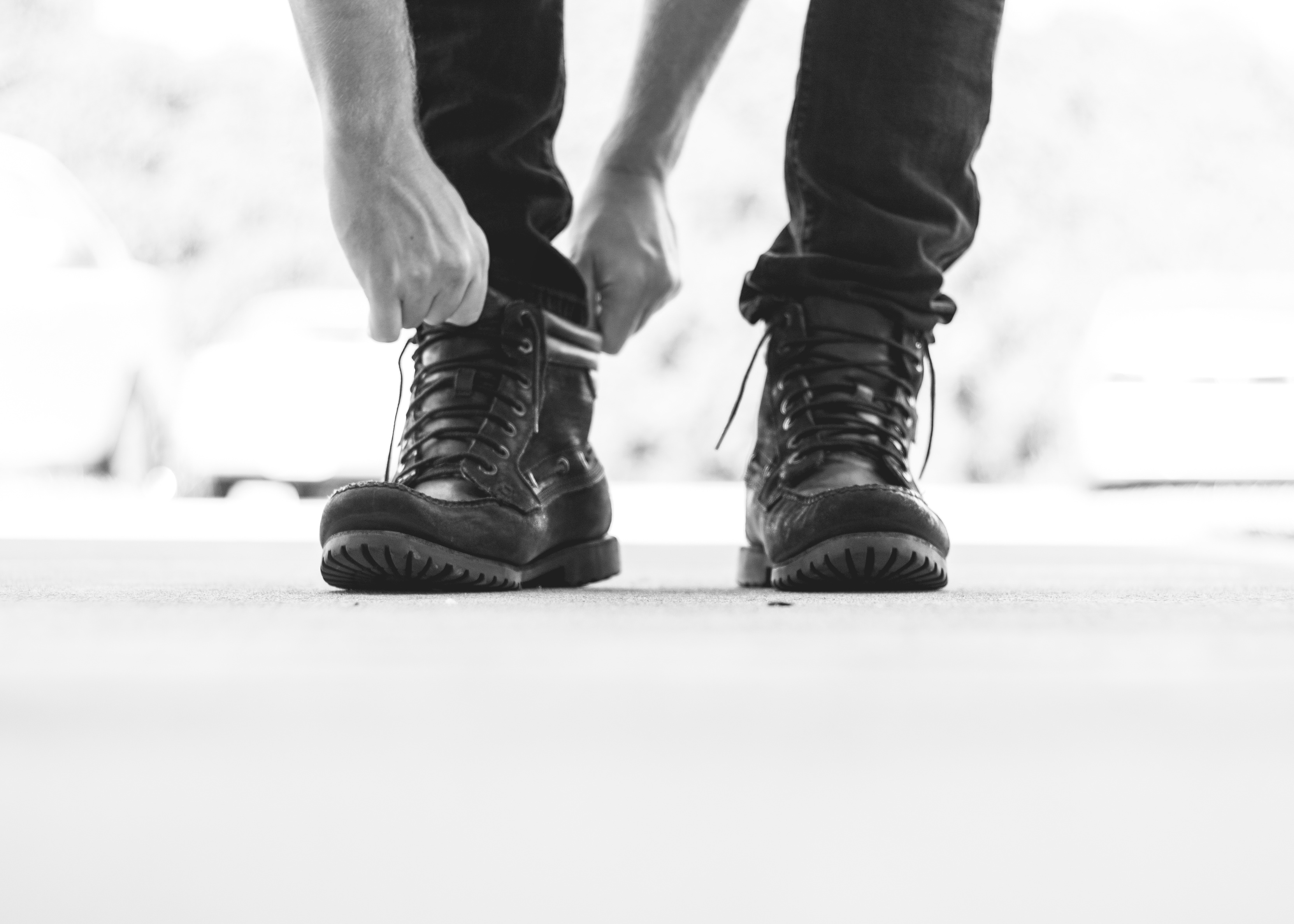 guy putting on boots